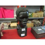 A carved hardwood African female bust