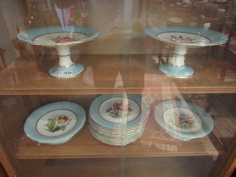 A Victorian hand painted cake set (Harlequin design) with blue border and central floral design