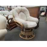 A swivel cane conservatory chair