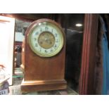 A late 19th Century mahogany arch top mantel clock,
