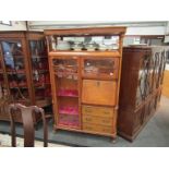 A Bredemier style birdseye maple cabinet,
