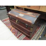 A Victorian canvas and wood domed travel trunk