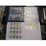 An album of modern coinage including a collection of 50p coins,