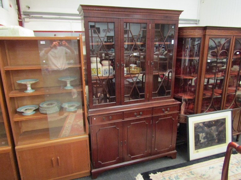 An astragal glazed top over three drawer display cabinet,