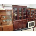 An astragal glazed top over three drawer display cabinet,