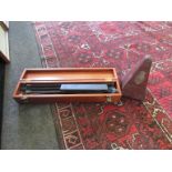 A hardwood cased metronome and a music stand