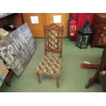 A Victorian needlepoint nursery chair with barley twist supports and legs