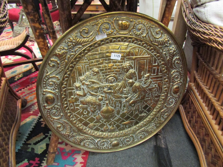 A brass embossed tray 63 cm diameter