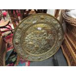 A brass embossed tray 63 cm diameter