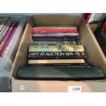 A box containing an assortment of art related reference books