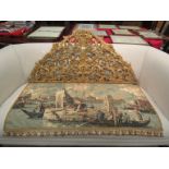 A needlepoint wall hanging of a Venetian scene hung by gilded foliate mount