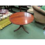 A reproduction mahogany tripod coffee table with circular top