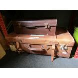 Two vintage leather suitcases