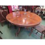 A Victorian walnut oval centre table with scroll carved quatreform base, 137cm long,