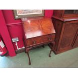 A Georgian style crossbanded figured walnut writing bureau the fitted interior and pull down fall