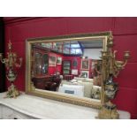 A modern gilt framed wall mirror,