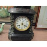 A black marble mantel clock