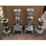 Two pairs of Victorian faience candlesticks, 25cm and 17.