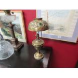 A Victorian brass oil lamp and shade with glass cabochons,