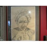 A framed and glazed pen and ink study depicting Arab smoking a pipe, indistinctly signed,