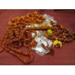 A quantity of rough cut amber necklaces,