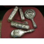 Silver dressing table items including cherub design (7)