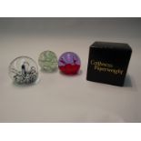 Three art glass paperweights including Caithness and Langham