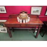 A late Victorian oak serving table the raised back over two frieze drawers on bobbin turned legs,