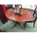 A mid Victorian burr walnut oval tilt top table on turned column and tripod base,