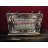 An early 20th Century silver mounted desk calendar