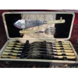 A cased set of fish knives and forks