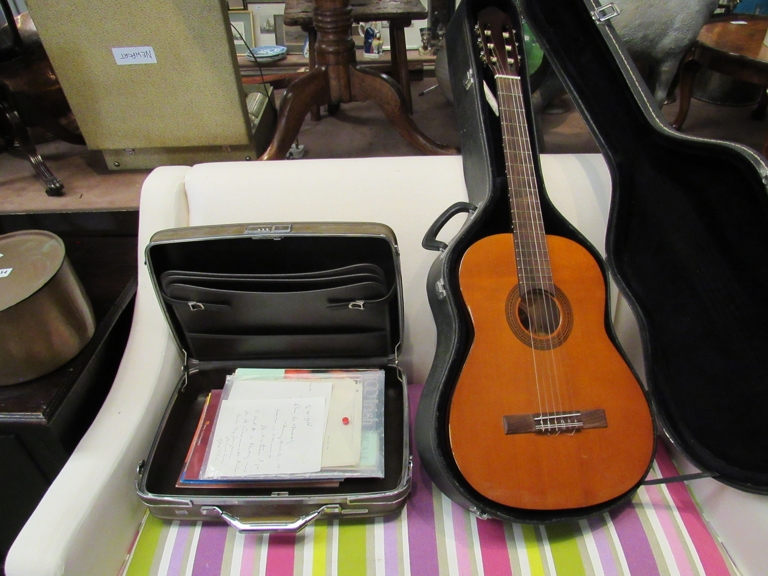 A Dulcet Classical acoustic guitar in hard case and a collection of music books including guitar