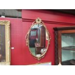 A gilt framed oval wall mirror,