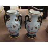 A pair of Victorian vases decorated with butterflies, 18.