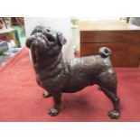 A limited edition solid bronze figure of a standing pug, boxed with certificate 23/50, 20cm tall,