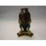 A Victorian Majolica pedestal vase on high paw feet, 21.