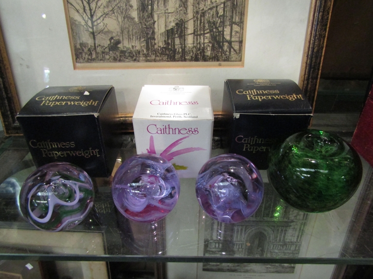 Three Caithness art glass paperweights with boxes,