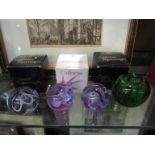 Three Caithness art glass paperweights with boxes,