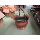 A Victorian copper coal scuttle of helmet form