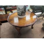 A circa 1920 burr walnut occassional table the pie crust edge top over cabriole leg supports,