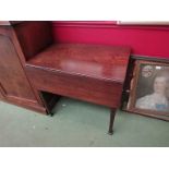 A George III mahogany Pembroke table on chamferred tapering legs and carved feet,