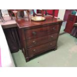 A George III style crossbanded flame mahogany chest of three long drawers over bracket feet,