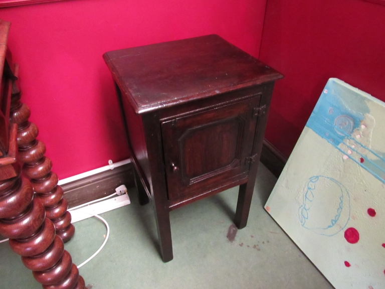 A 17th Century style pegged oak single drawer bedside cupboard with iron hinges on square legs,