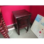 A 17th Century style pegged oak single drawer bedside cupboard with iron hinges on square legs,