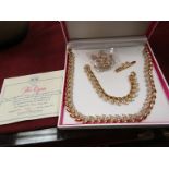 A Pink Paisley "Her Majesty The Queen" suite of jewellery from Sterling Mint, with certificate,