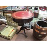 A George III style mahogany occassional drum table the gilt tooled leather insert over two frieze