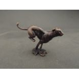 A miniature solid bronze running cheetah