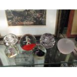 Six various glass paperweights including bubble design