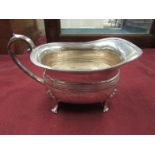 A silver milk jug by John Turton and Co,