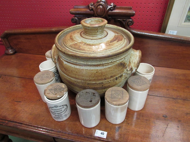 A large Studio pottery lidded jar with eight stoneware marmalade jars